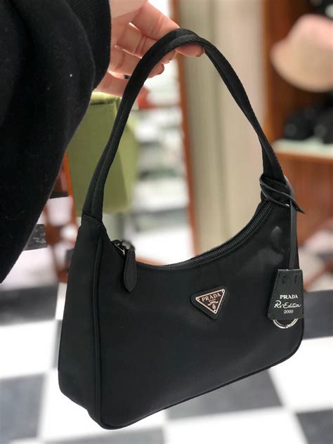 prada small black bag|Prada bag with mini pouch.